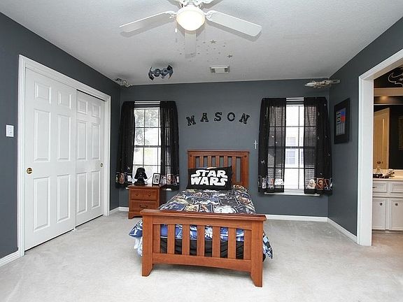 One of the 3 bedrooms up. Notice the large closet and windows.