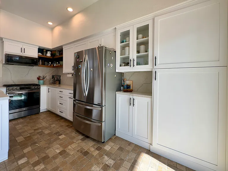 Kitchen with large pantry doors