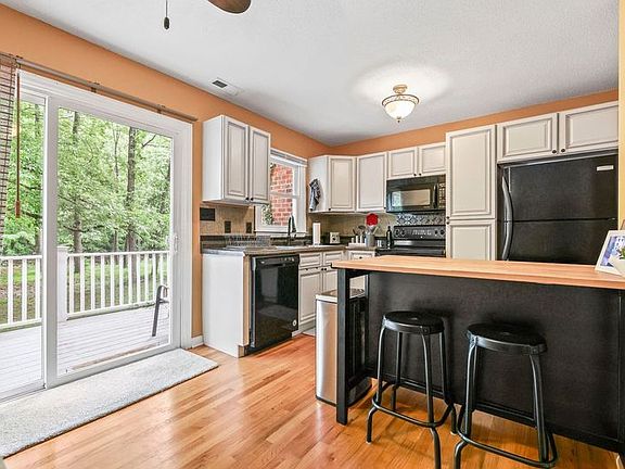 Fully stocked kitchen with access to back deck. Great for morning coffee!