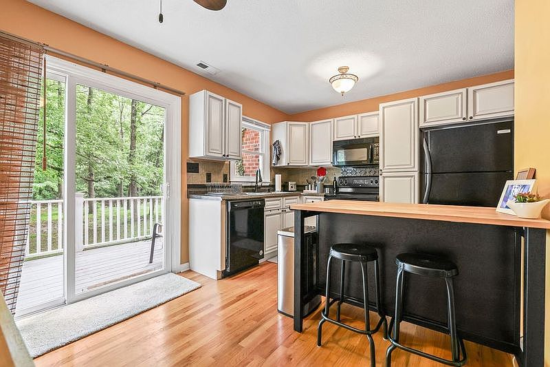 Fully stocked kitchen with access to back deck. Great for morning coffee!