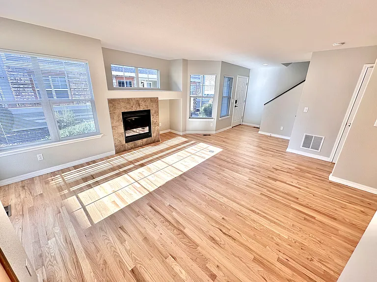 Main level living area with gas fireplace.