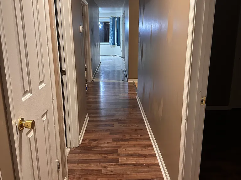 Hallway from bedrooms to kitchen/living room/family room
