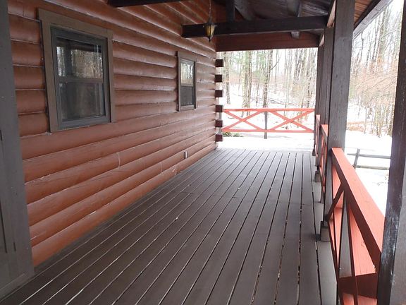covered front porch area looking towards side deck