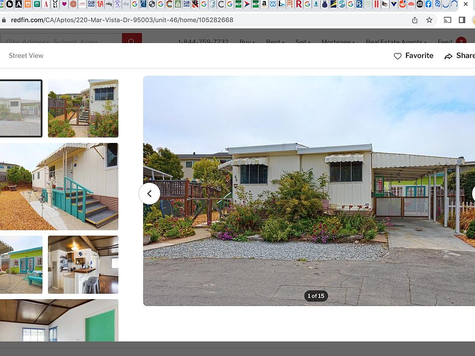 Front of the mobile home. Parking under the carport on the right and in front on the gravel patch.