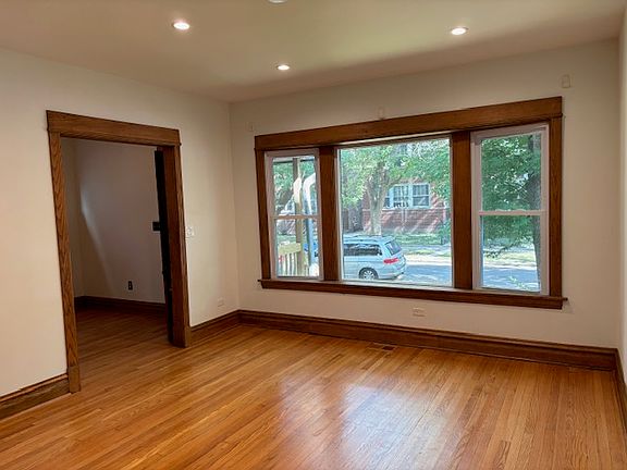 Large, open concept living room with big windows.
