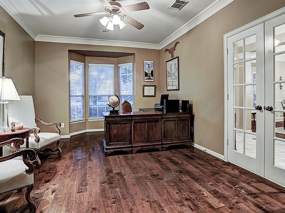 Office is open and spacious, currently holding an L-shaped desk and has room for chairs!