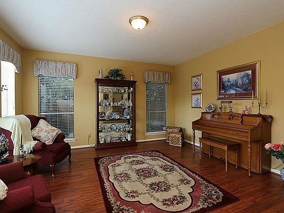 Bright formal living room is very large.