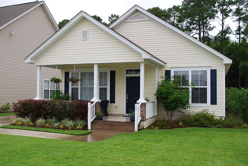 FRONT
						:
						WELCOMING FRONT PORCH WITH BRICK PILLARS