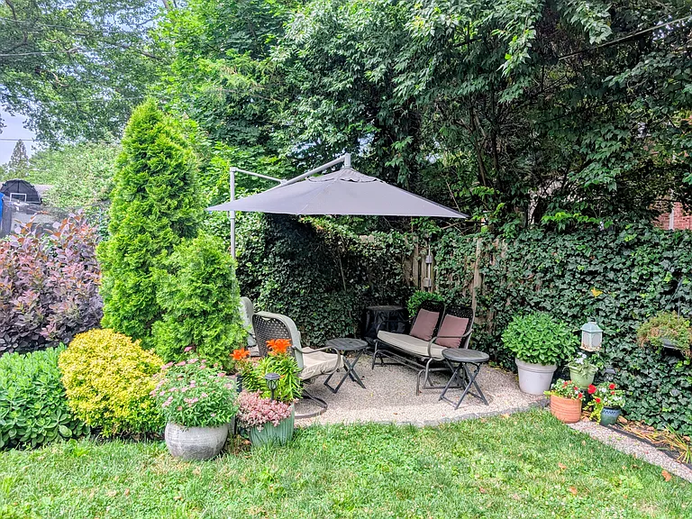 Cozy and lush oasis in the fully fenced backyard