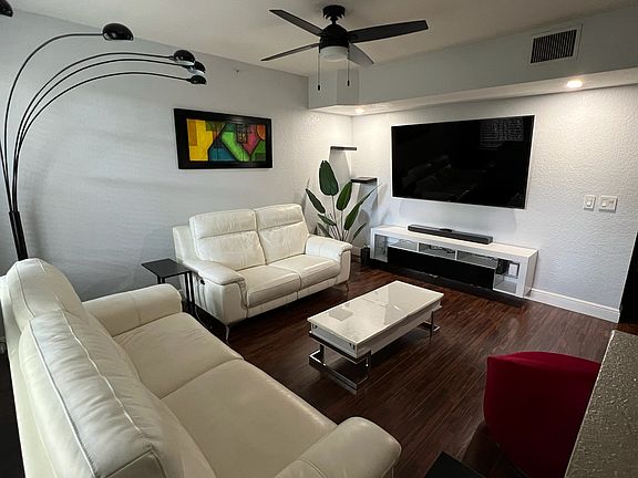 75-in mounted TV and floating TV console