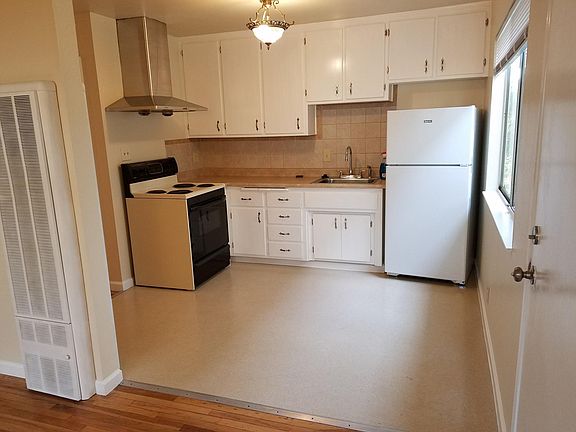 Kitchen, new fridge and garbage disposal