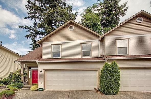 Two-car garage with some mobile shelving. Two spaces in the