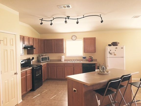 Light and bright kitchen!  Lots of cabinets, pantry closet and center island.  Perfect for entertaining!