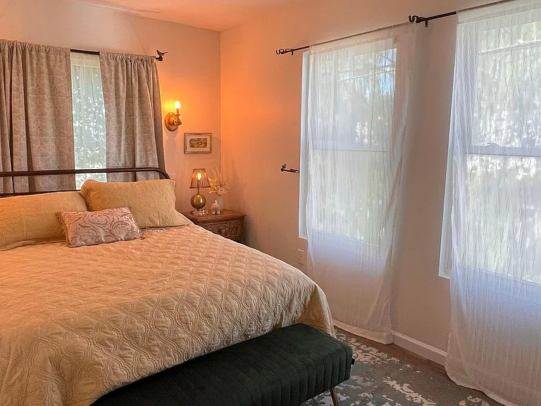 Single bedroom with queen sized-bed. Sheer curtains will be replaced with blackout curtains for optimum sleep. Temperature-controlled by the guest. Bedroom is also fully decorated and cozy.