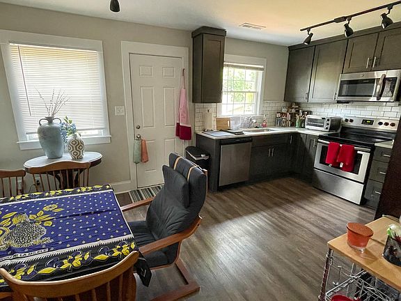 Kitchen is completely updated with new appliances. Back door leads to exterior patio seating area.
