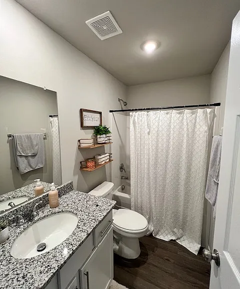 Hall bathroom features granite countertops and shower/tub.