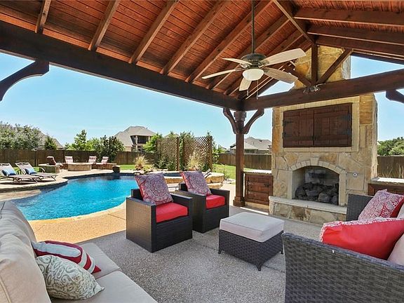 THE SPACIOUS CABANA OFFERS A GAS FIREPLACE, TELEVISION SPACE, AND IS A GREAT PLACE TO STAY COOL WHILE ENJOYING THE POOL ON A HOT SUMMER DAY!