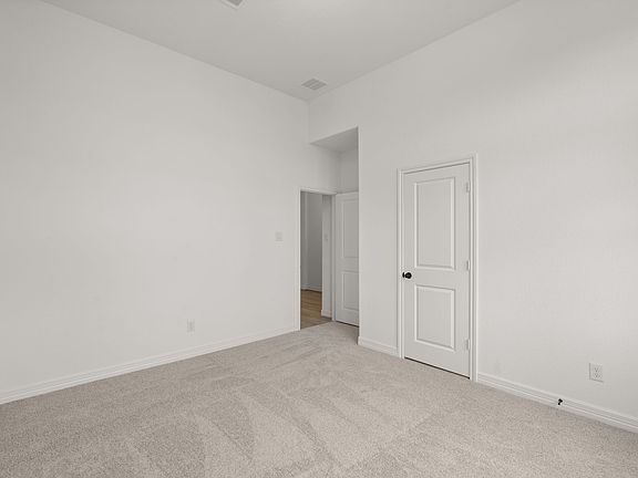 An additional view of the second bedroom and closet.