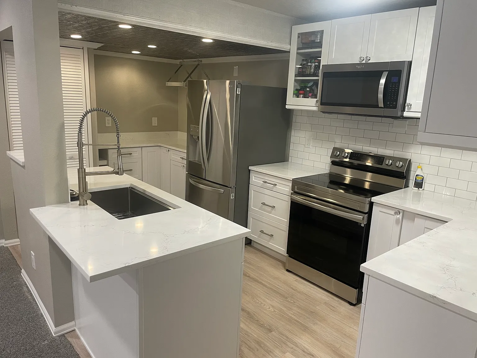 Completely remodeled and updated kitchen with stackable laundry unit.