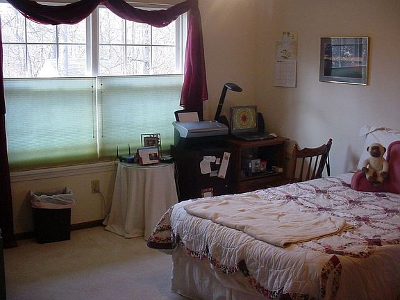 Master bedroom measures 14x12, and looks out to large trees out back. 