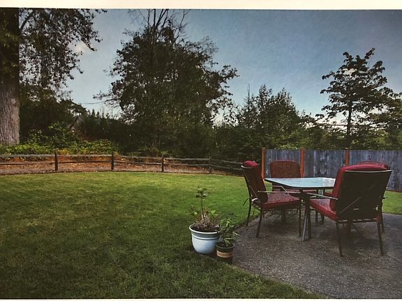 Large backyard overlooking greenbelt. A fence has since been put in for privacy