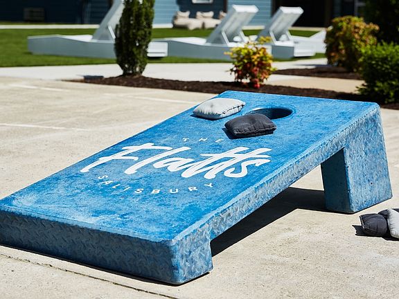 Have Fun on Our Gaming Patio with Cornhole at The Flatts Salisbury