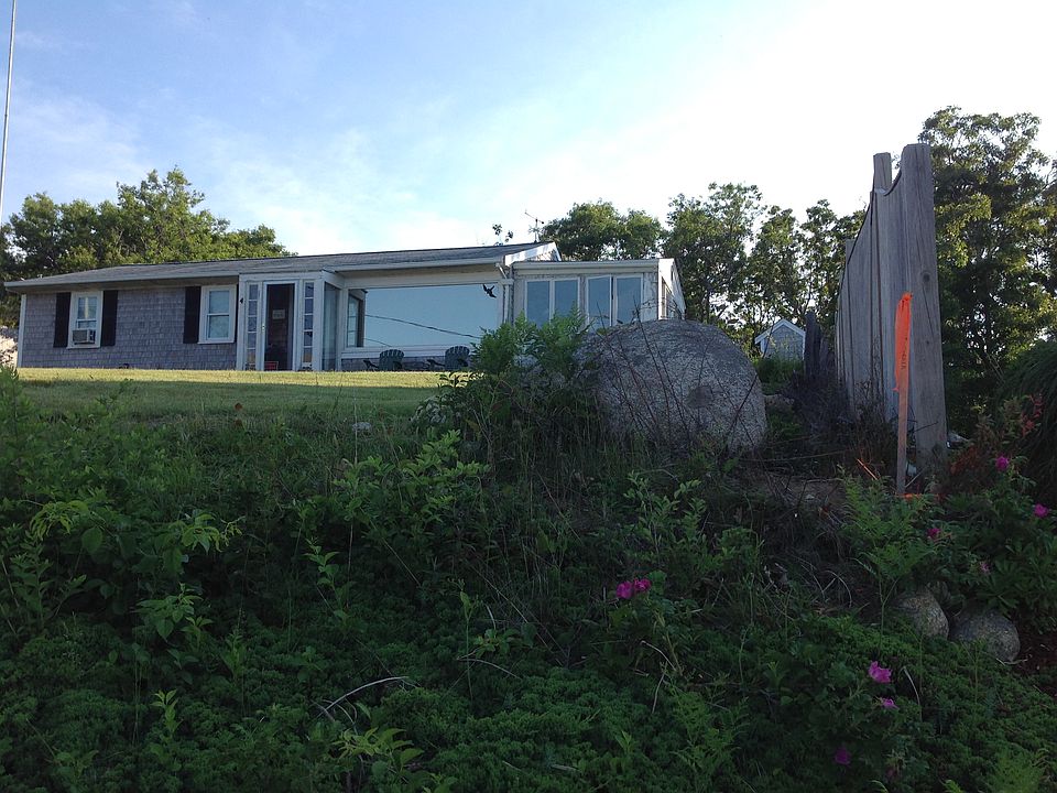 HOUSE SITS ON A SLIGHT HILL