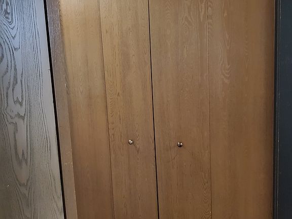 Multiple closets in hallway leading to the bedrooms.