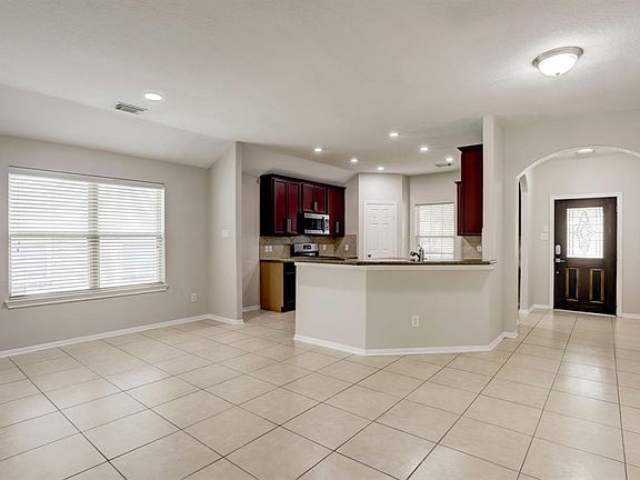 The kitchen opens up to the large breakfast area and living room.