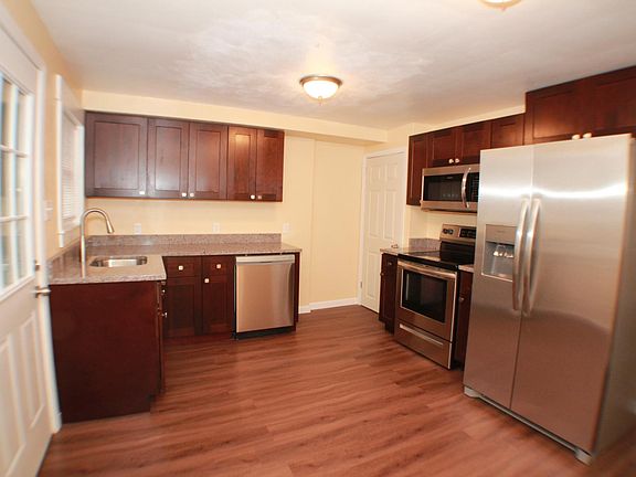 New granite countertops and stainless steel appliances. New custom cabinets.