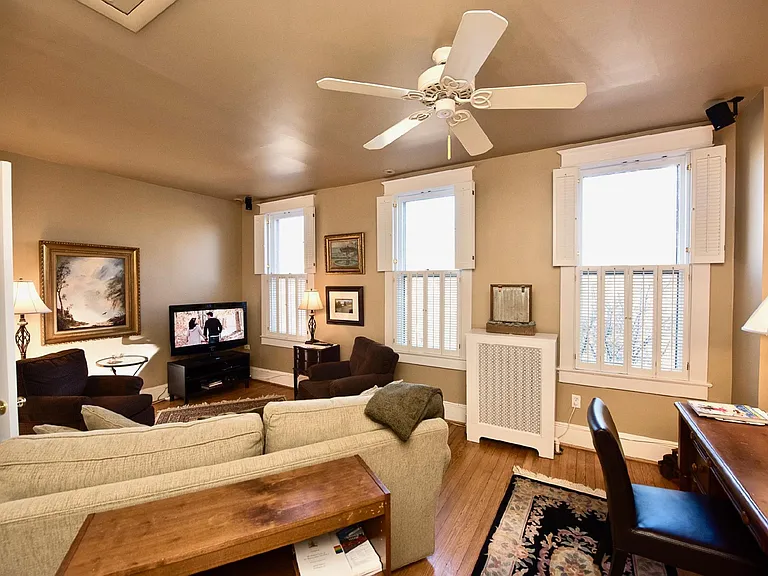 Second bedroom configured as a den with queen sleeper sofa for guests.