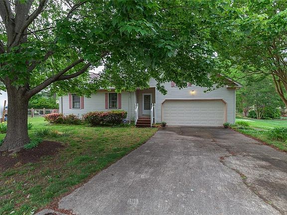 This home has ample driveway space and an attached two car garage