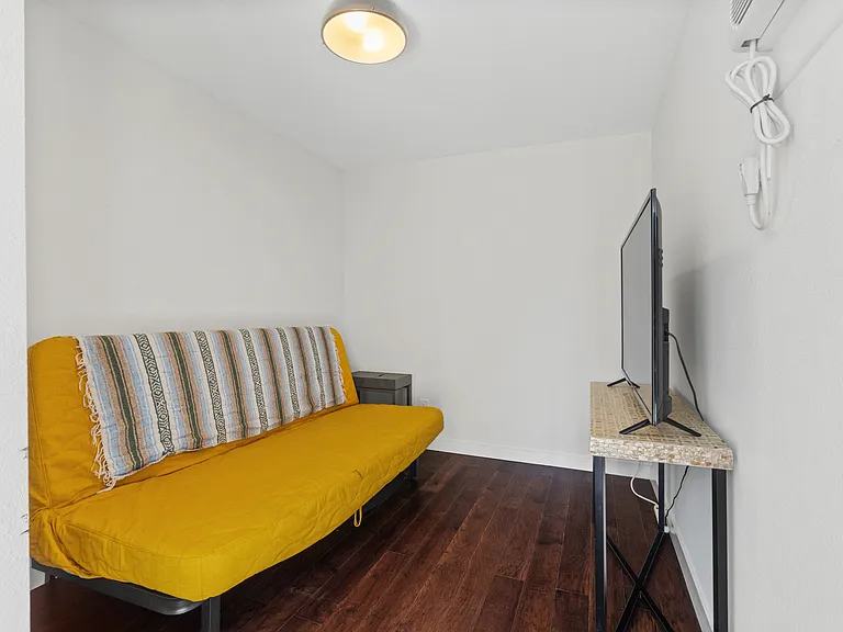 Bonus room and bathroom in converted garage.
