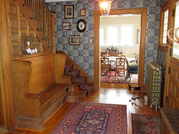 Wood floor, built-in bench with storage, detailed wood work