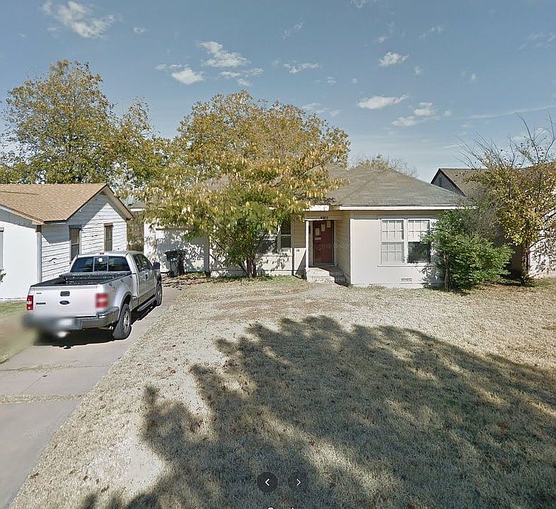 Yard and large driveway 