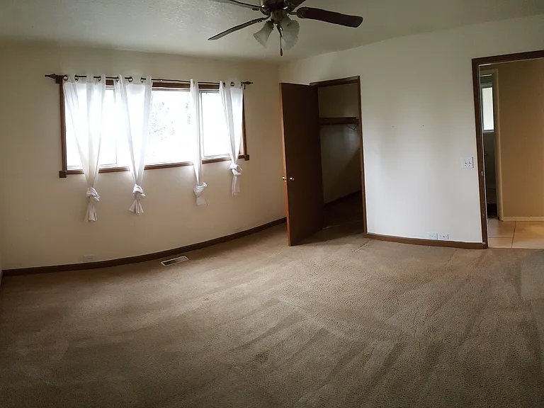 The master bedroom is in back of house the ceiling fan helps to keep it cool in the summer, new carpet and xl walk in closet