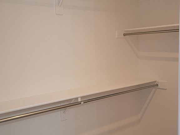Walk in master bedroom closet
