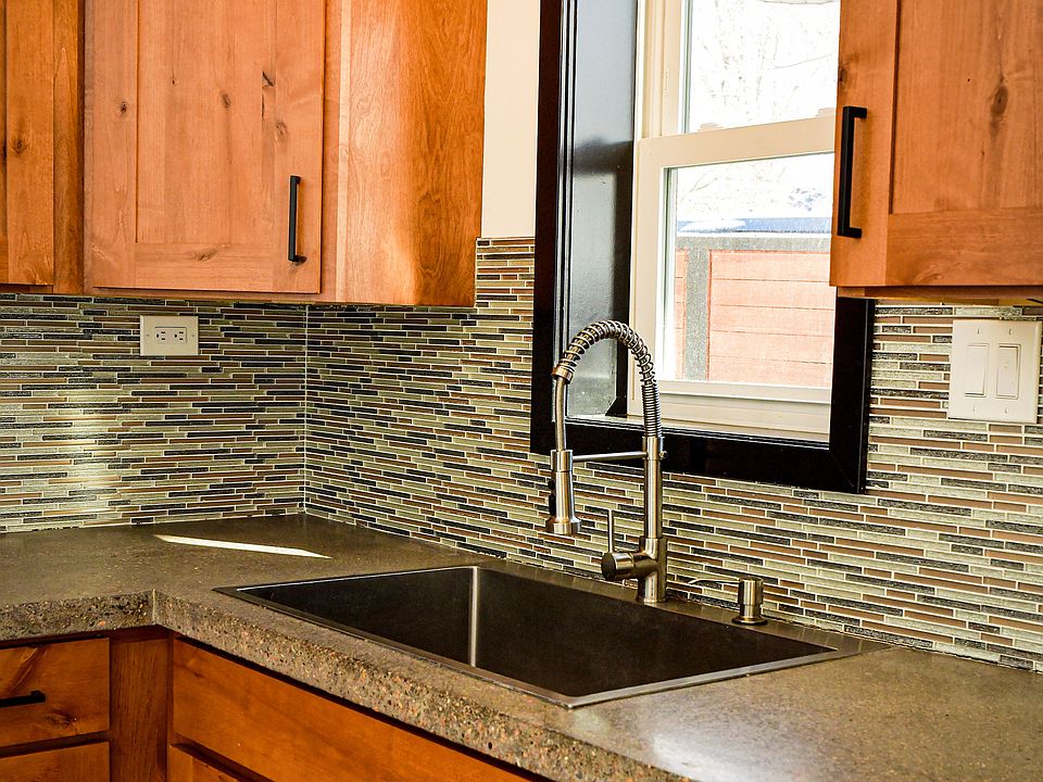 Newly renovated kitchen with concrete counters.
