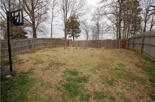 Look at all of the yard space you would have in the spacious backyard.