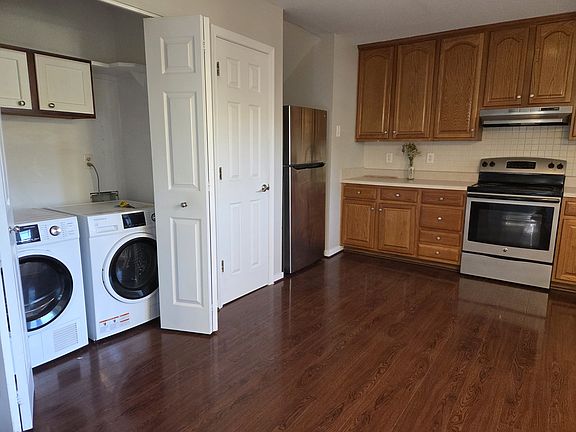 Kitchen conveniently contains laundry closet and large pantry.