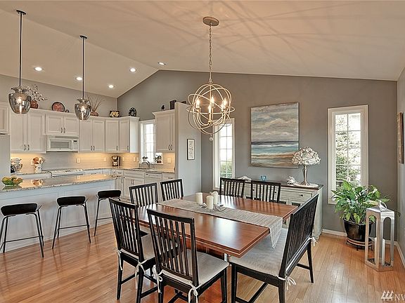 Open remodeled kitchen with large island and room for table.