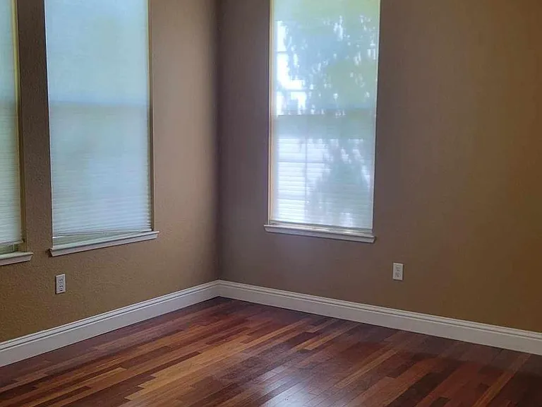 Downstairs bedroom with private bathroom at front of house - plants provide privacy from street view