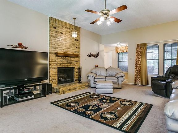 This spacious room features a tall ceiling and wonderful natural light