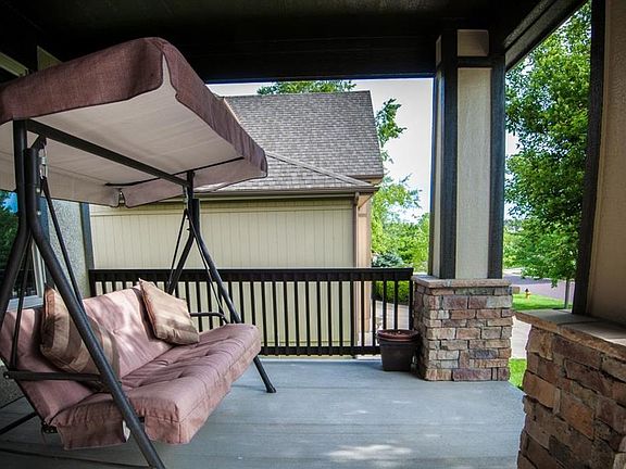 Large Covered Front Porch with stone trim! Enjoy your evenings