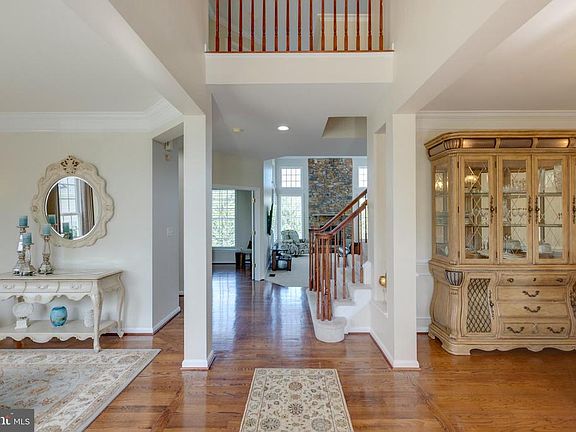 Beautiful two story foyer with hardwood
