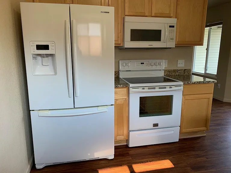 Bottom Mount Freezer Ice & Water Refrigerator, 5-burner convection oven range, Over-the-range microwave with turntable & shelf