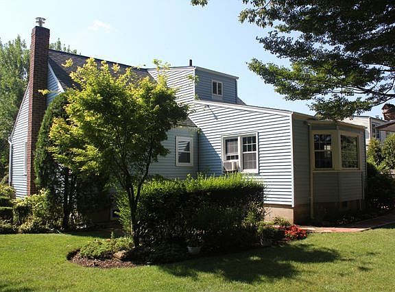 Back of home showing dining room addition