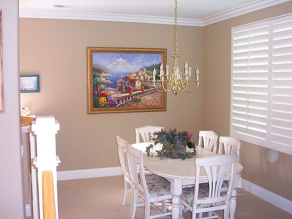 Formal dining room w/plantation shutters