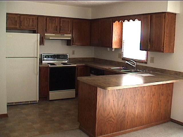 The kitchen and breakfast bar -- appliances included.
