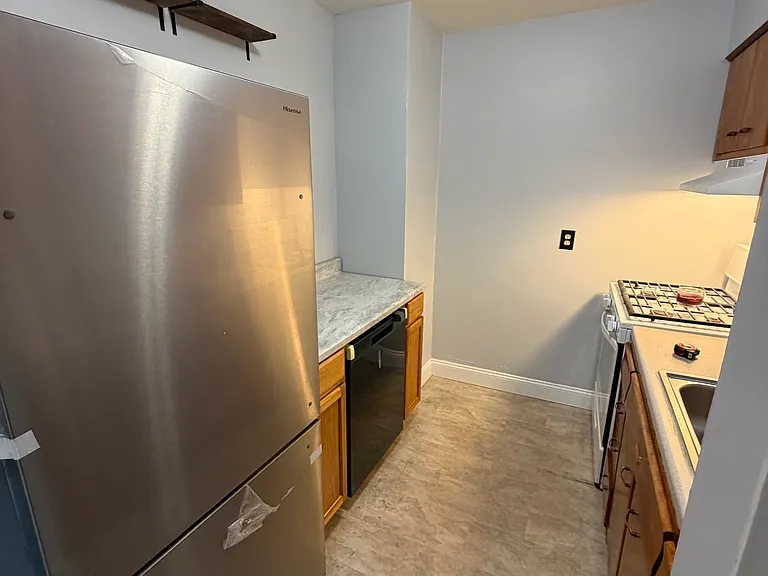 Kitchen. Brand-new fridge (thus the plastic still on it). Brand new dishwasher.